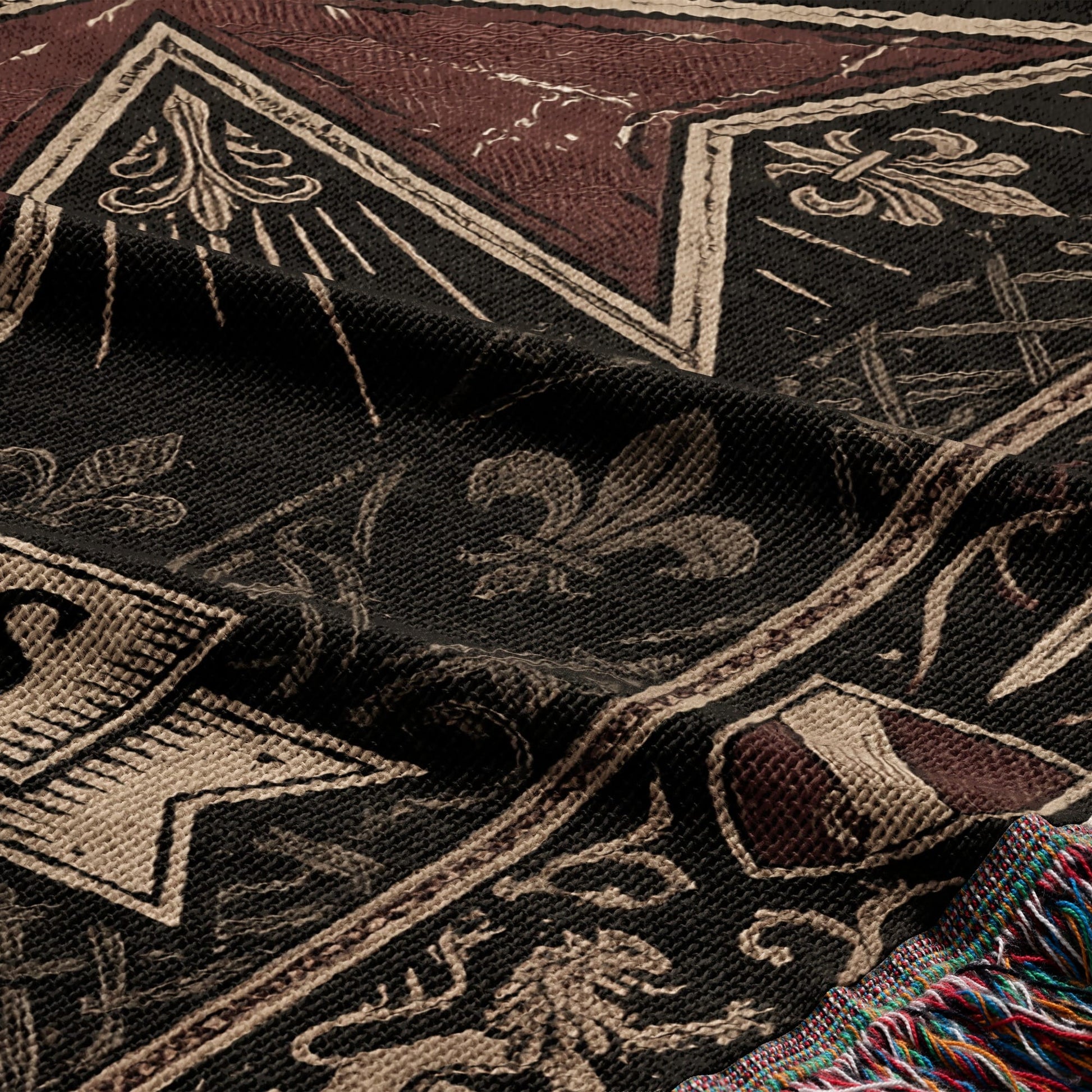 Woven tapestry featuring crests, lions, and fleur-de-lis on a dark background.