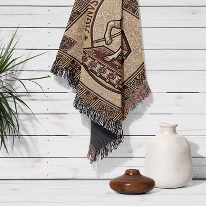Textile tapestry with horse and chariot design hanging on wooden wall.