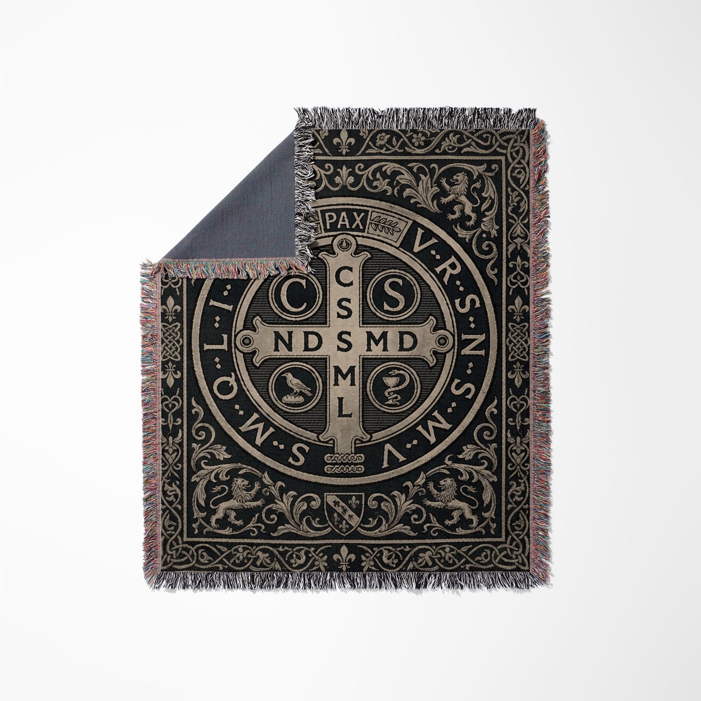 Woven blanket with Saint Benedict medal design, lions, and ornate scrollwork.