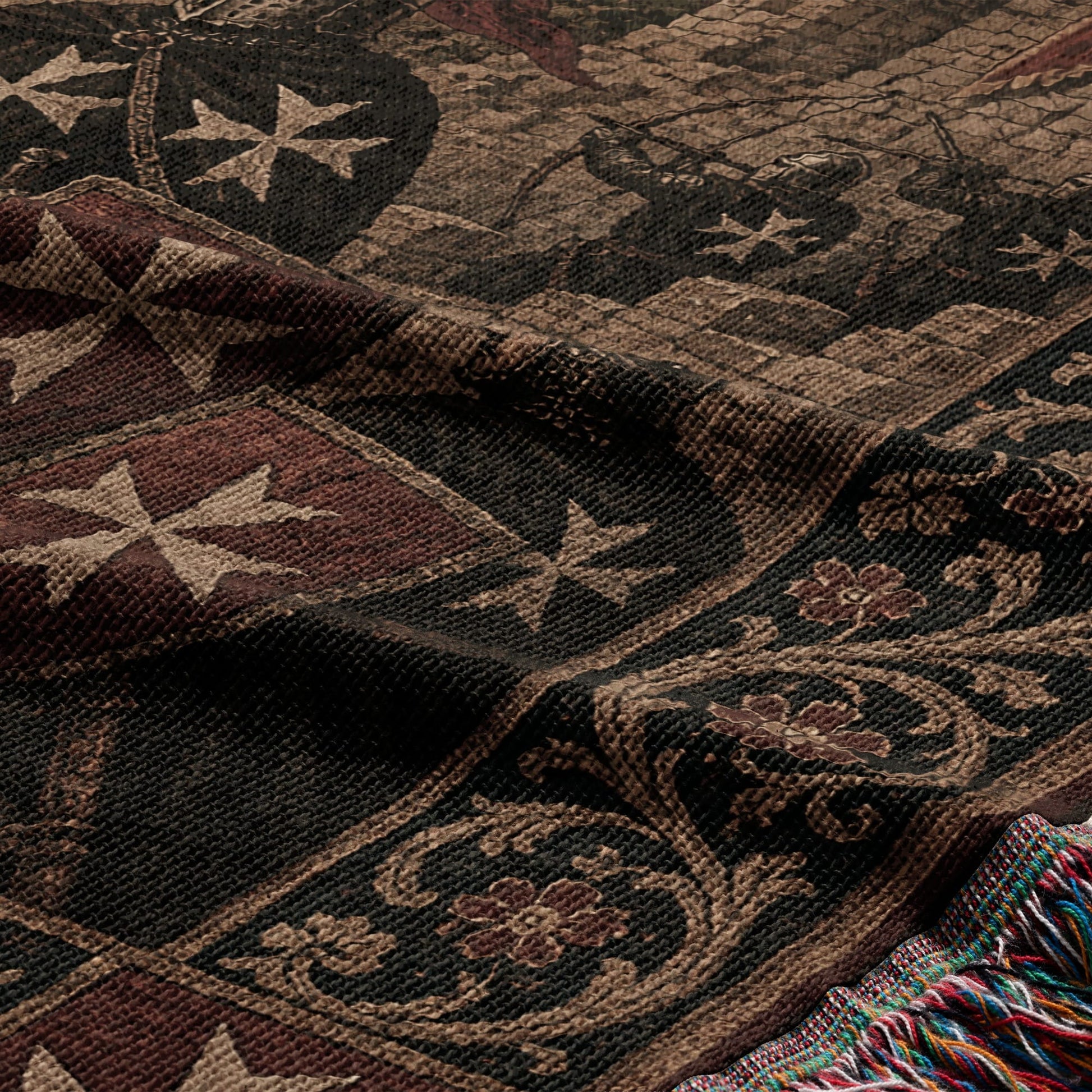 Woven tapestry blanket with Maltese crosses and floral patterns, featuring fringed edges.