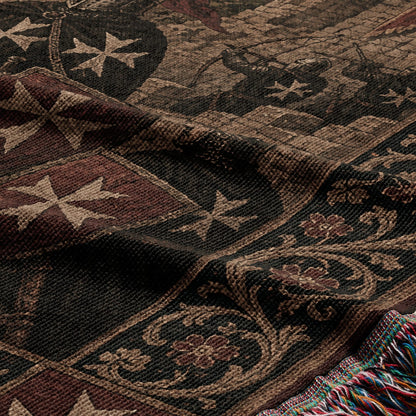 Woven tapestry blanket with Maltese crosses and floral patterns, featuring fringed edges.