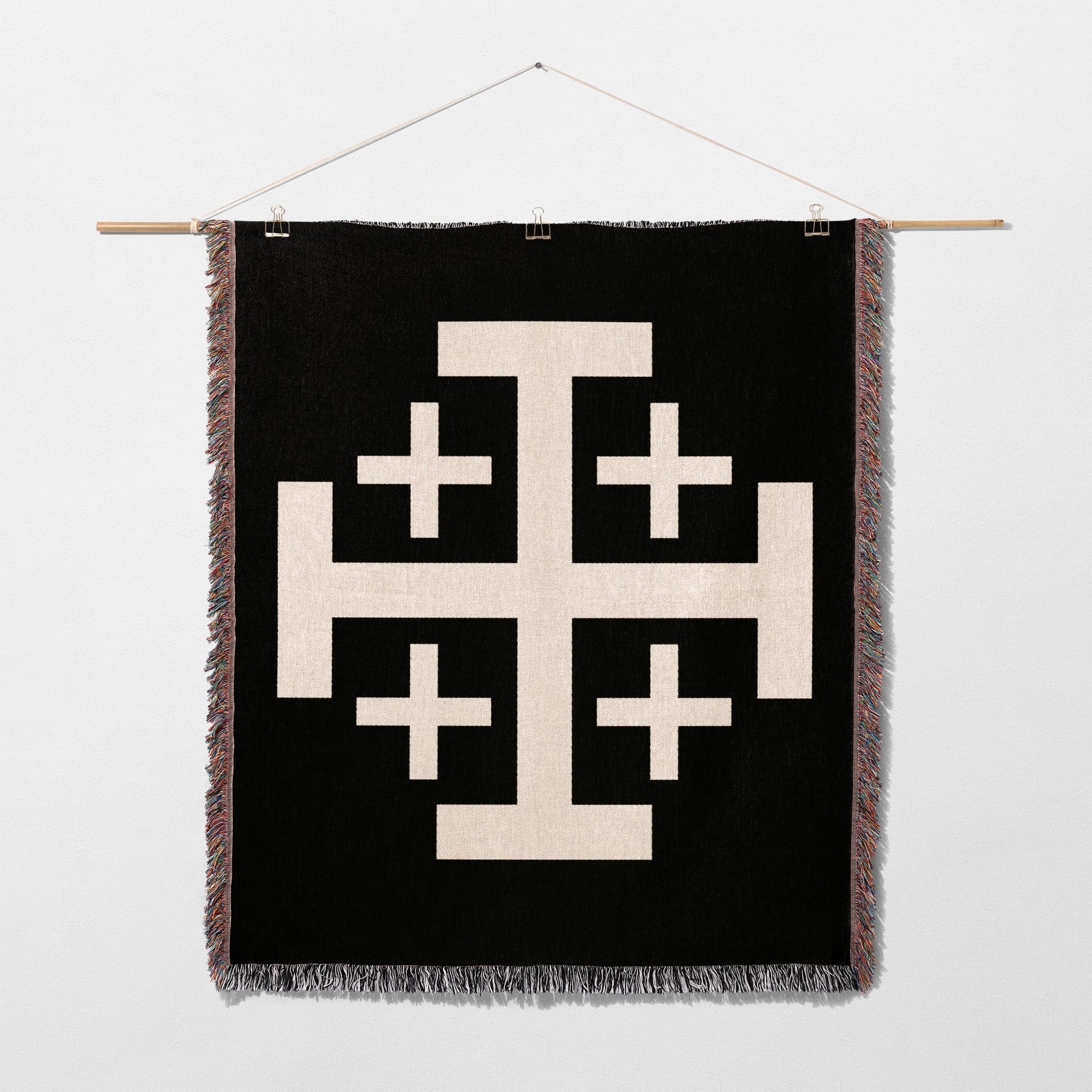 Black blanket with large white Jerusalem cross design.