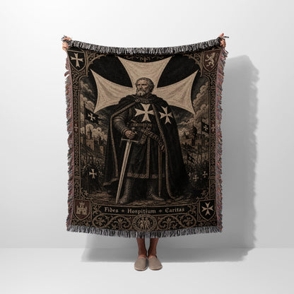 Tapestry with knight in armor, sword, and cross motif, bordered by fringe.