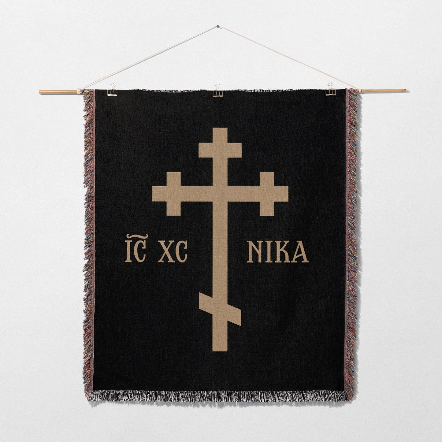 Black tapestry with a gold Orthodox cross and "IC XC NIKA" text.